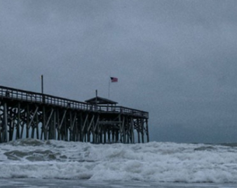 beach dock with strong waves