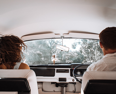 couple driving older van