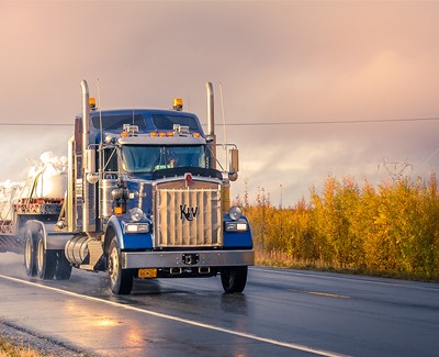 Truck driving on farm backroads
