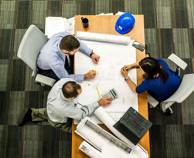 Group reviewing construction plans