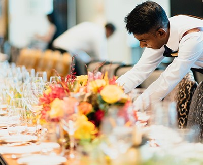 Waiters setting up table