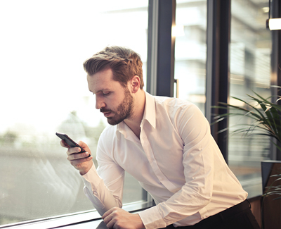 man looking at phone