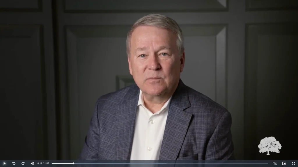 image of a man in a suit speaking to the camera, placeholder image for Oakbridge Overview video