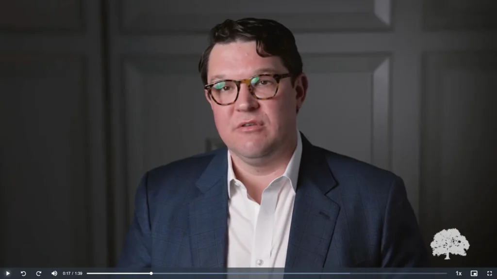 image of a man in a suit speaking to the camera, placeholder image for Partnering with Oakbridge video